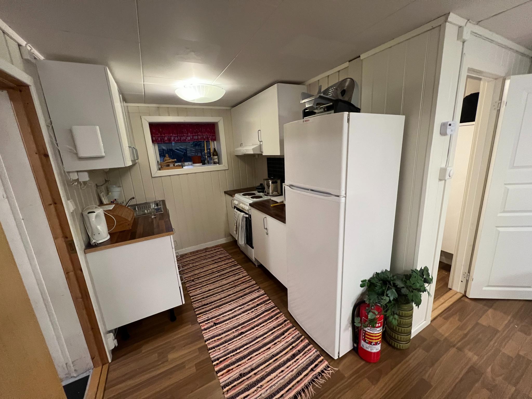 Kjøkken med åpne løsning til stue