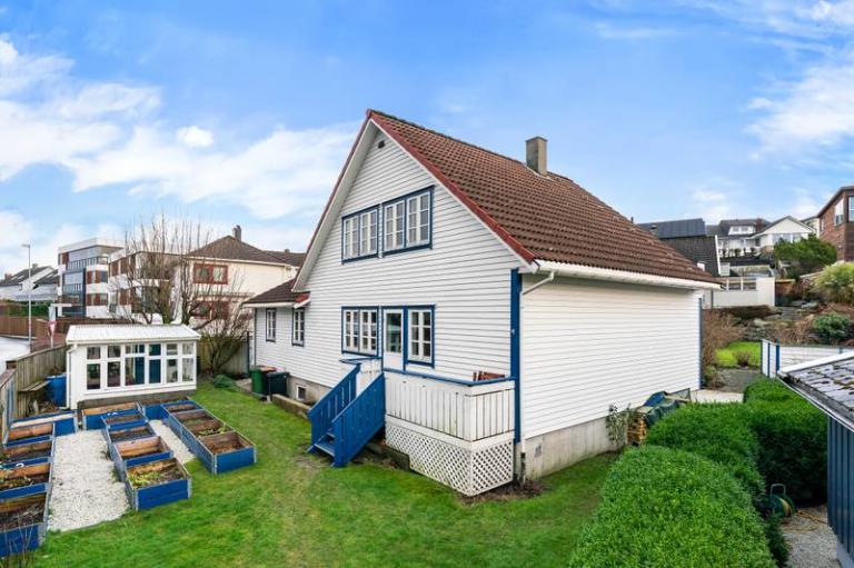 Apartment is located in the basement, behind the blue stairs. 